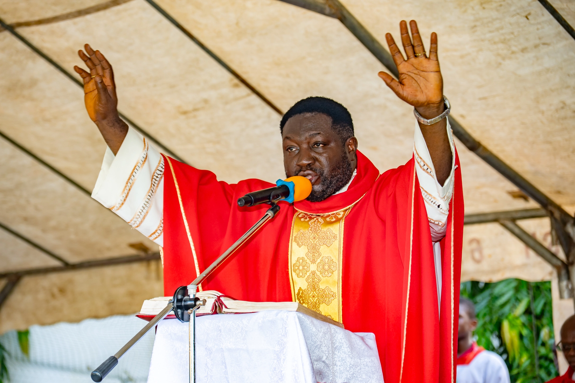 Fr. Agi Livinus preaching at the outdoor Mass