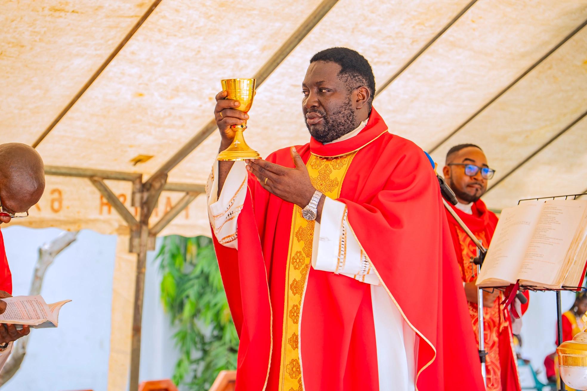 Holy Communion being administered during the outdoor Mass