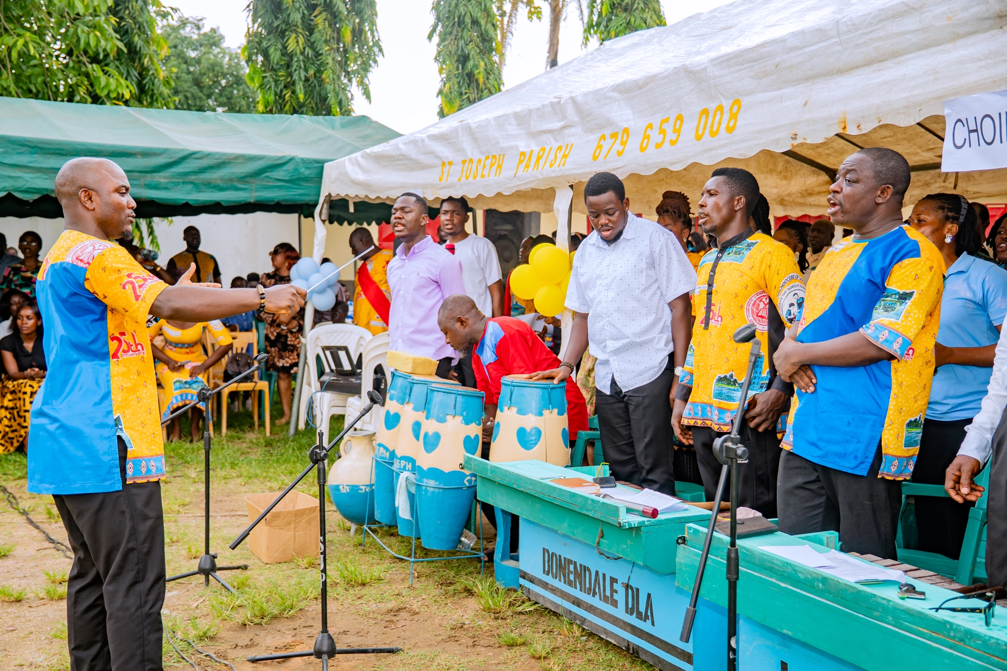 Parishioners playing traditional drums