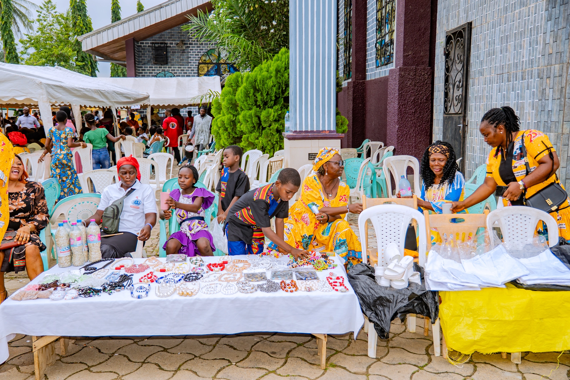 Wide view of parishioners gathered across the grounds