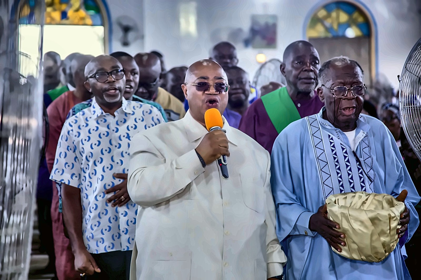 Members of the Catholic Men's Association bringing their gift to the altar