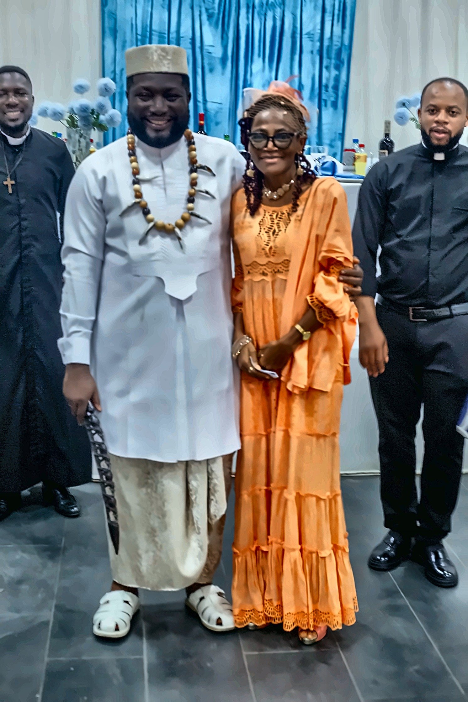 Fr. Livinus poses with a parishioner