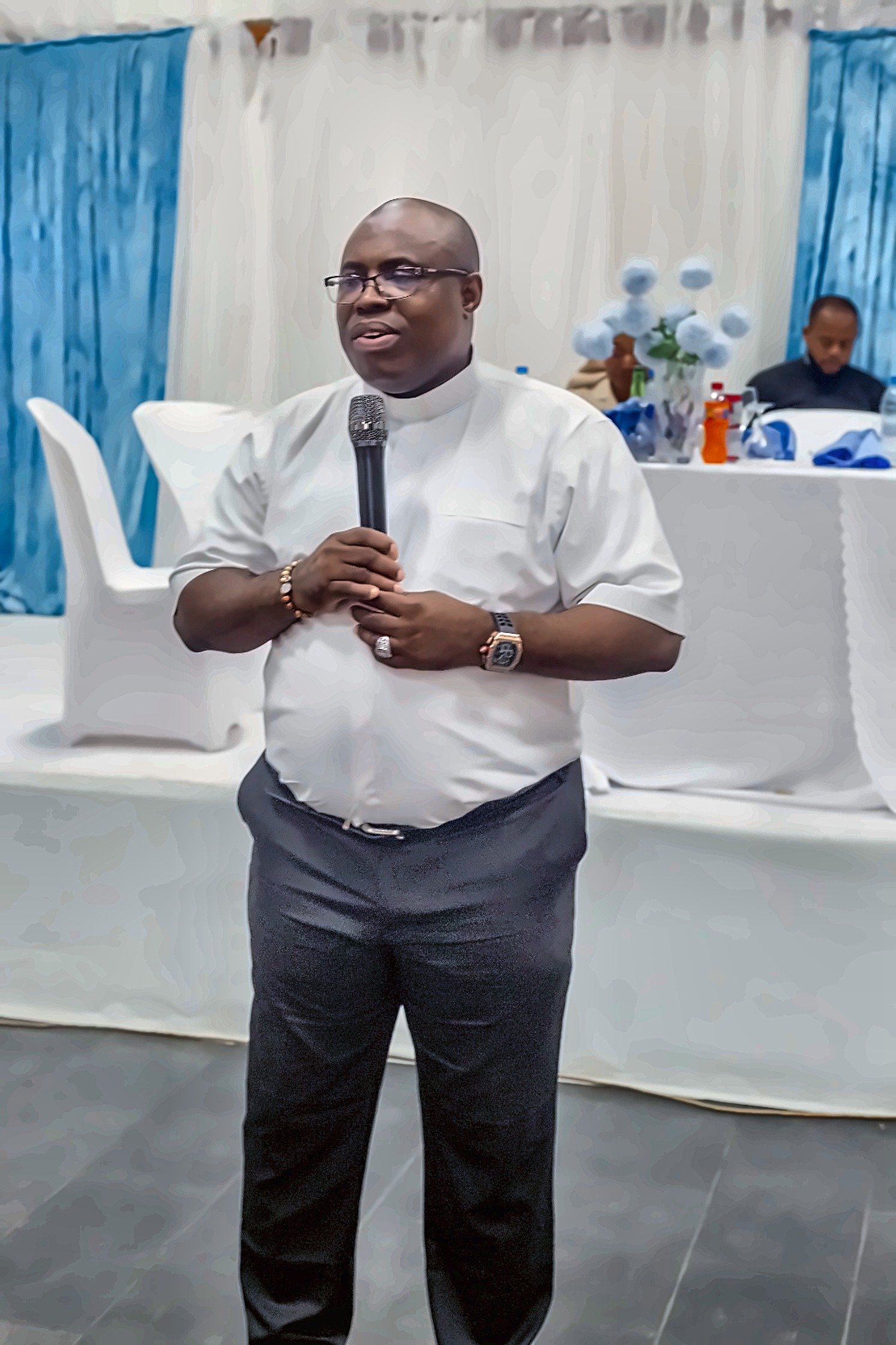 Fr. Mark Ameh making a speech at the reception