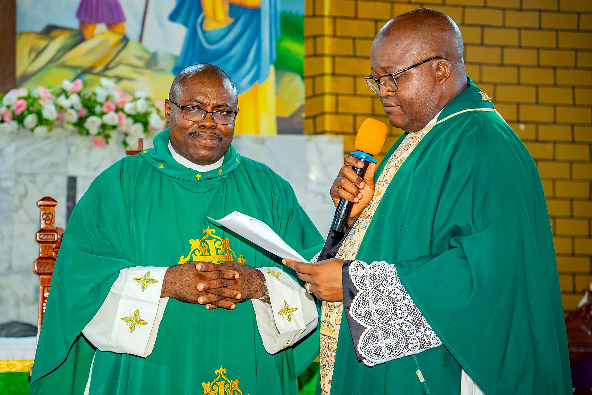 Fr. Mark Ameh Installed as Parish Priest of St. Joseph the Worker, Bonaberi Fr. Mark repeats the vows after Monsignor Michael